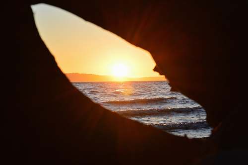 saltwater state park hole overseeing orange sunset des moines